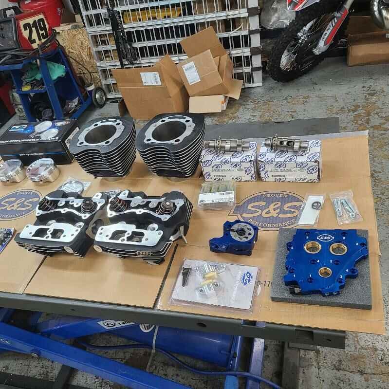 S&S engine parts laid out on workbench